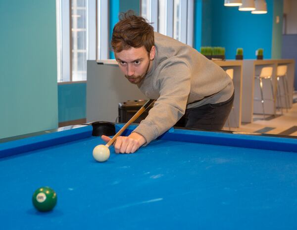 Hays Hopkins plays billiards during a break at the SalesLoft offices in Atlanta on February 2nd, 2018. For story in the AJC Top Workplaces section.  (Photo by Phil Skinner)