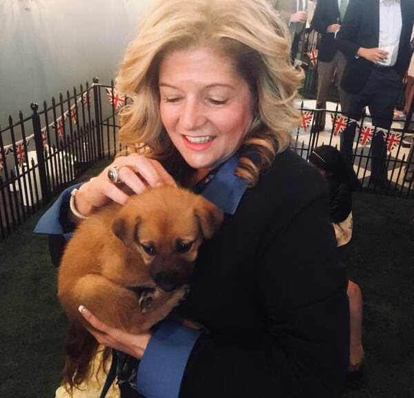  Tracie Arnold and one of the event's most cuddly guests.