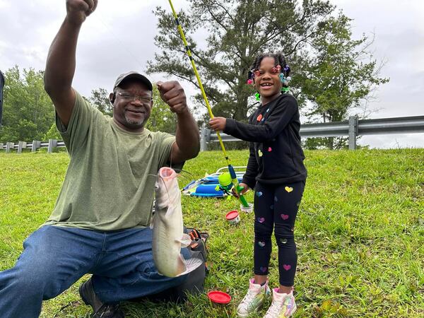 They’re certainly biting at Sweetwater Creek State Park as a father helps his daughter land a big one. 
(Courtesy of the Georgia Department of Natural Resources)