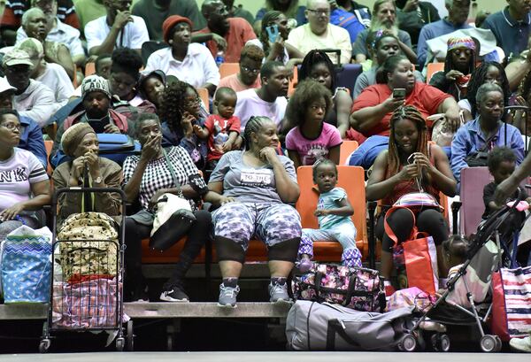 September 3, 2019 Savannah - Hundreds of local residents sit and wait inside the Savannah Civic Center to get a free transportation to inland shelters under mandatory evacuation ahead of Hurricane Dorian on Tuesday, September 3, 2019. Chatham Area Transit (CAT) provided free transportation to residents without private transportation to the Savannah Civic Center to assist in the mandatory evacuation of Chatham County. (Hyosub Shin / Hyosub.Shin@ajc.com)