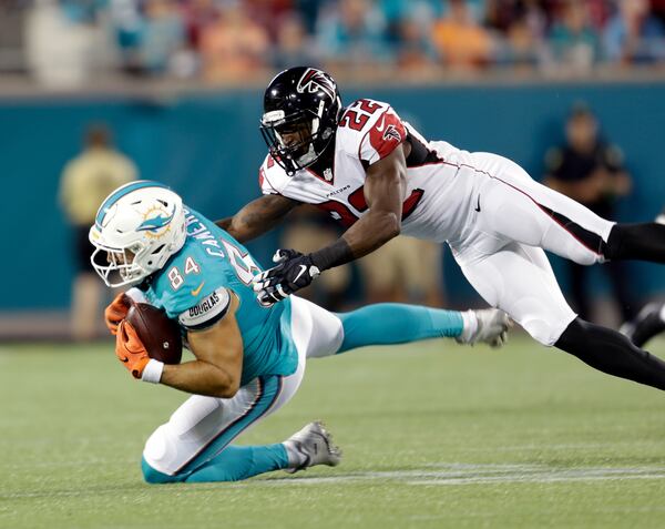 Miami Dolphins tight end Jordan Cameron (84) is brought down by Atlanta Falcons strong safety Keanu Neal (22) after a reception during the first half of an NFL preseason football game in Orlando, Fla., Thursday, Aug. 25, 2016.(AP Photo/Willie J. Allen Jr.)