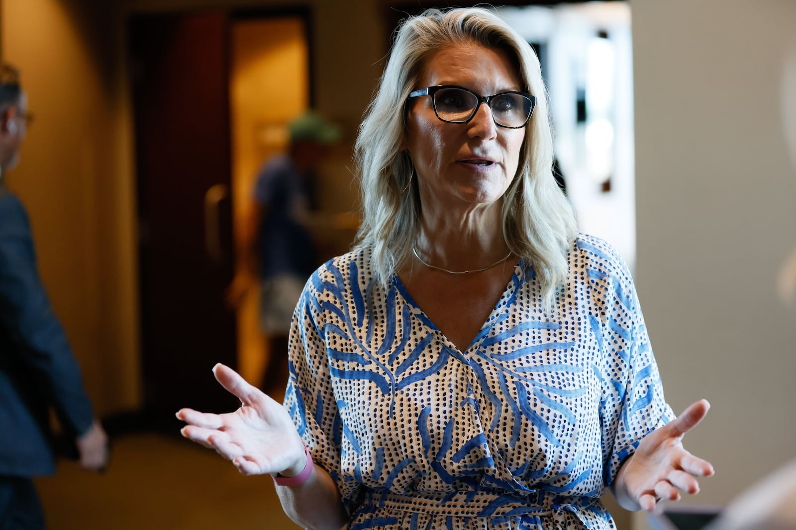 Defense attorney Kim Frye speaks to an AJC reporter at Cobb County Superior Court after Chief Judge Gregory Poole issued a 30-day emergency order on Wednesday, suspending filing deadlines and other administrative requirements in civil and criminal cases.
(Miguel Martinez / AJC)