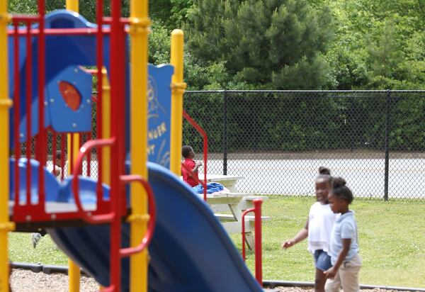 Children play on the playground at Dobbs Elementary School in Atlanta on Wednesday, May 1, 2019. Dobbs is among 11 Atlanta schools interested in a program that would open up its playground for use as a public park during the summer, on the weekends and after school. EMILY HANEY / emily.haney@ajc.com