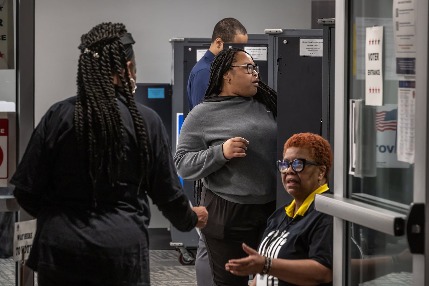 Najlaa Green (center) casts her vote at the Buckhead Library located at 269 Buckhead Avenue NE, in Atlanta on Friday, Nov. 1, 2024, on the last day of early voting in Georgia.  (John Spink/AJC)