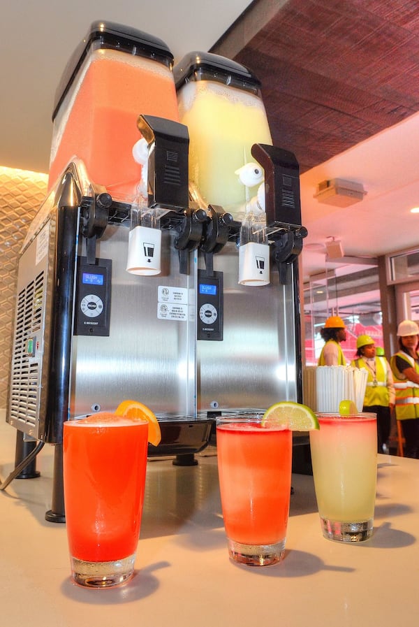 Sure, you’ll have no trouble finding beer at the new Mercedes-Benz Stadium, but frozen cocktails are an option, too: You can choose a Neighborhood Punch, a frozen mai tai with watermelon rounded with Jack Fire grenadine (far left); or a Signature MBS Margarita, a frozen margarita complemented by a red sangria float (far right); or have them both mixed into a colorful swirl combo (center drink). CHRIS HUNT / SPECIAL