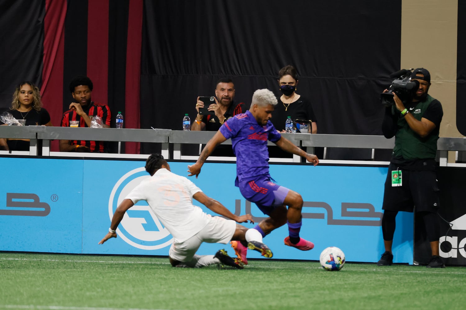 Atlanta United forward Josef Martinez gets past a Columbus Crew defender in the second half of an MLS soccer match at Mercedes-Benz Stadium on Saturday, May 28, 2022. Miguel Martinez / miguel.martinezjimenez@ajc.com