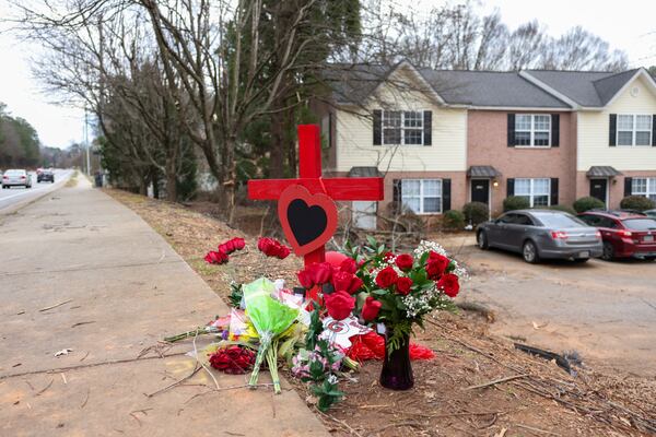 A memorial at the site of the crash that killed Georgia football staffer Chandler LeCroy and player Devin Willock.