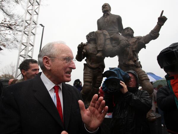 081129 Athens, GA:  Vince Dooley applauds after a statue of himself was unveiled at a dedication ceremony  for the University of Georgia Vince Dooley Athletic Complex in Athens Saturday November 28, 2008 in Athens.    Brant Sanderlin / bsanderlin@ajc.com