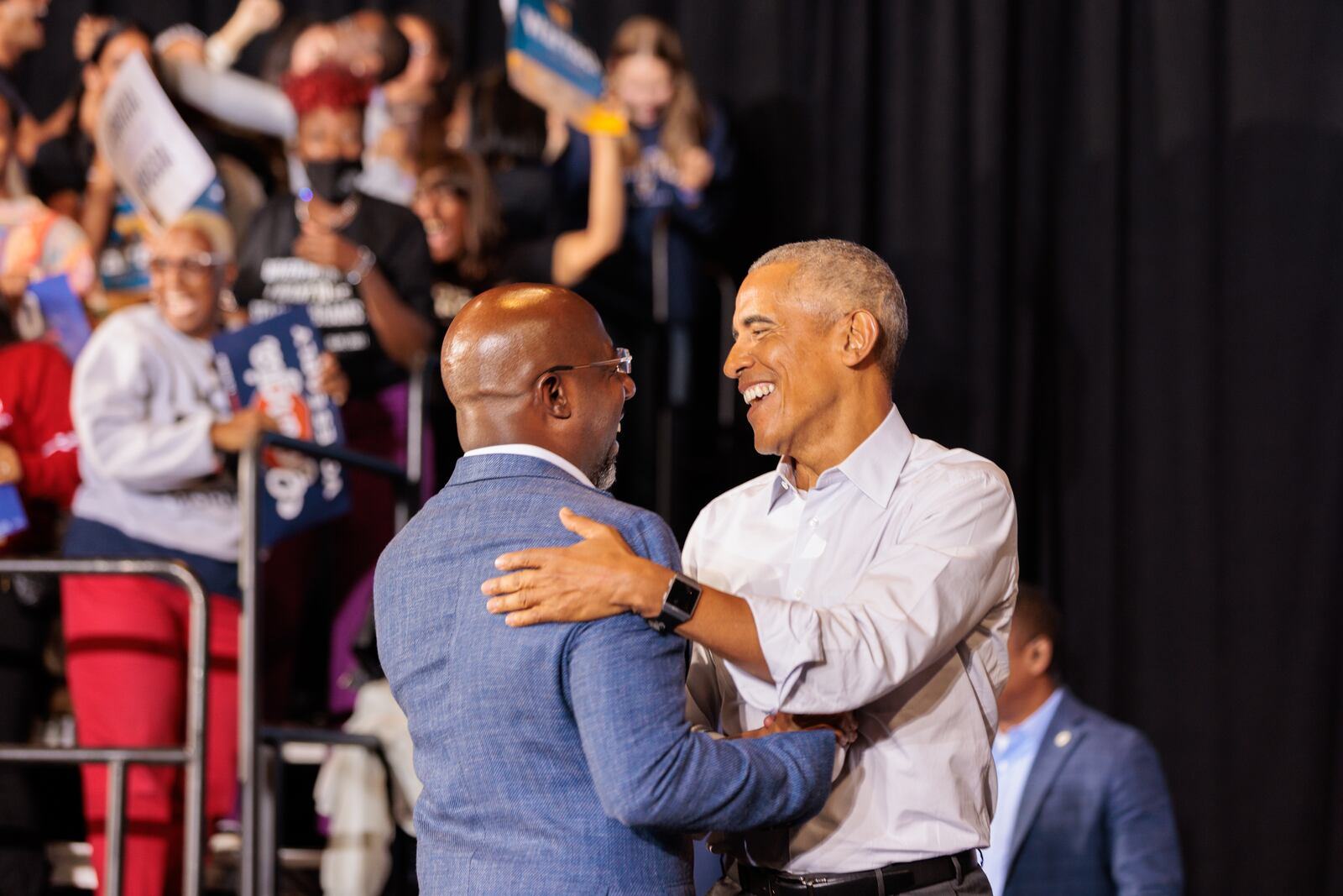 Former President Barack Obama, right, embraces U.S. Sen. Raphael Warnock at a campaign rally Oct. 28 for Democrats. President Joe Biden, who has a low approval rating in Georgia, steered clear of the state, so other high-profile Democrats, such as Obama, came to the aid of the party's candidates. (Arvin Temkar / arvin.temkar@ajc.com)