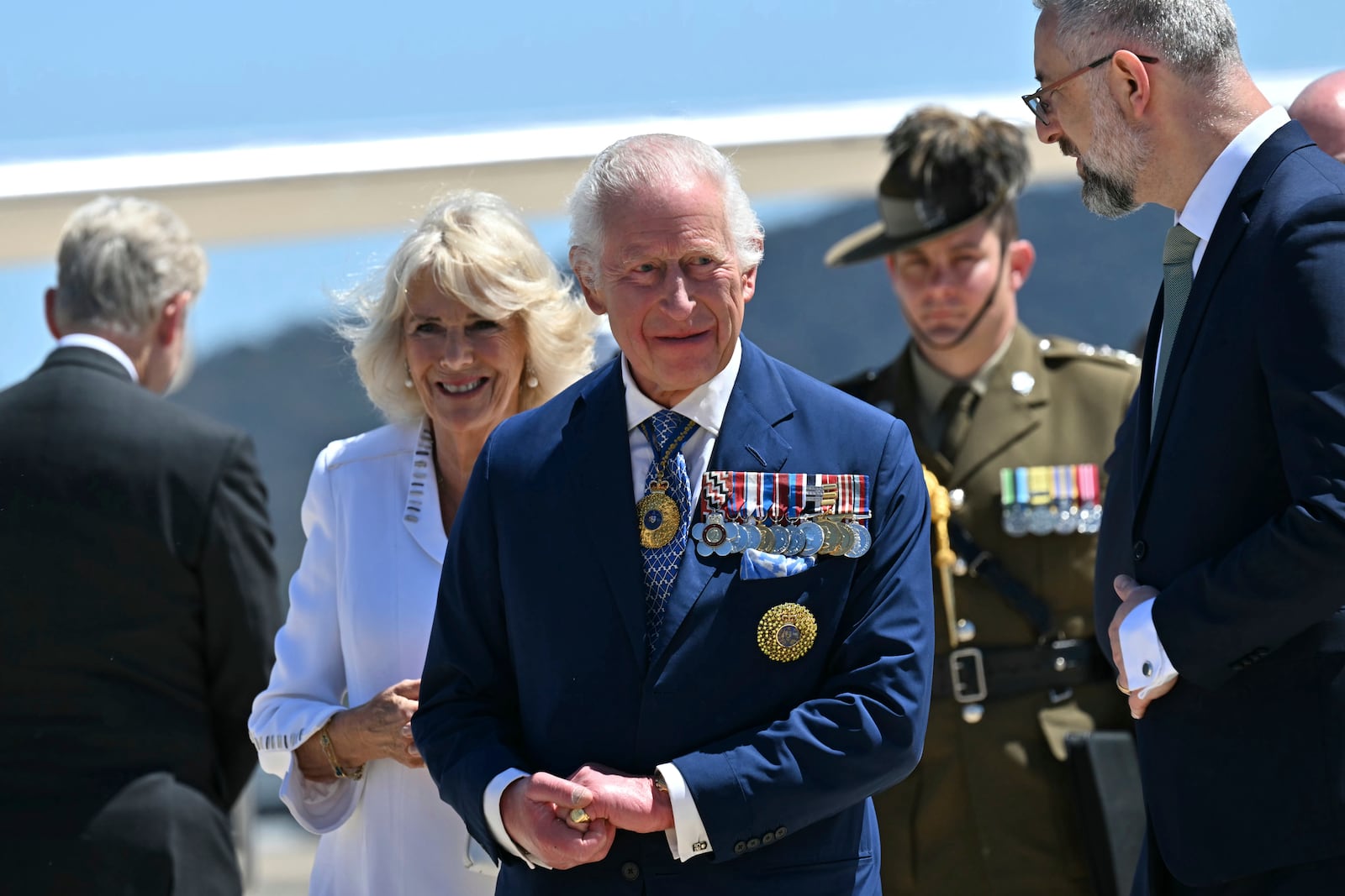 Britain's King Charles III and Queen Camilla arrive at Defence Establishment Fairbairn in Canberra, Australia, Monday, Oct. 21, 2024. (Saeed Khan/ Pool Photo via AP)