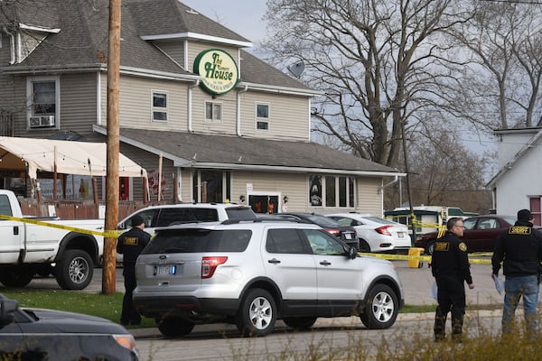 State and local investigators at the scene after three people were reported killed and two wounded in an early morning shooting at The Somers House bar in the village of Somers, Wisconsin. The bar is near Carthage College in Kenosha. (Mark Hertzberg/Zuma Press/TNS)