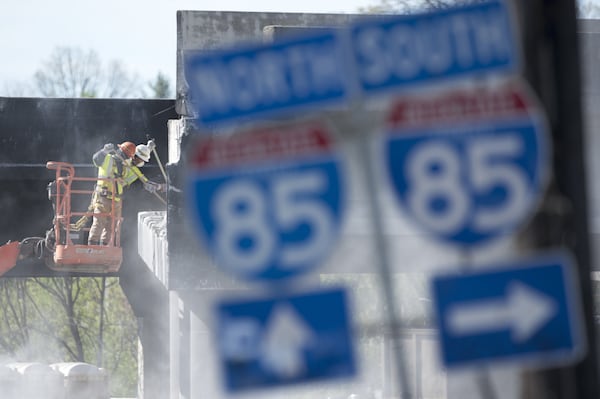 Demolition Sunday on the section of I-85 that collapsed. Workers have to take the bridge down before they can put it back up. (DAVID BARNES / DAVID.BARNES@AJC.COM)