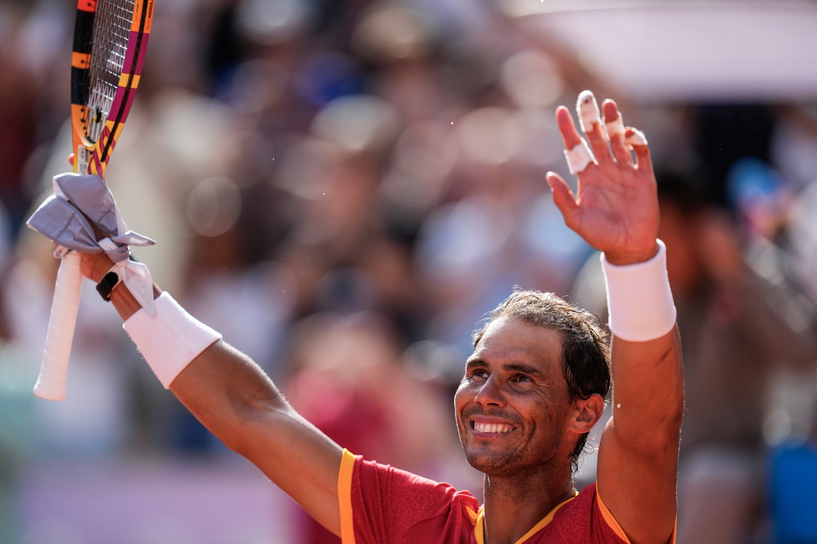 FILE - Rafael Nadal of Spain celebrates his victory over Marton Fucsovics of Hungary during the men's singles tennis competition, at the 2024 Summer Olympics, Sunday, July 28, 2024, in Paris, France, as he has announced he will retire from tennis at age 38 following the Davis Cup finals in November. (AP Photo/Manu Fernandez, File)