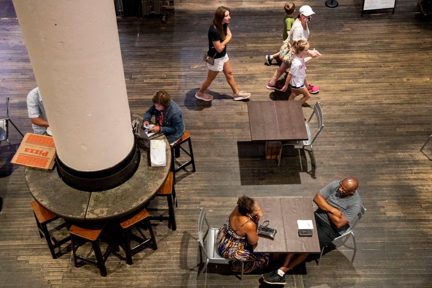 People walk through Ponce City Market both masked and unmasked on Tuesday, July 19, 2022, in Atlanta. (Chris Day/Christopher.Day@ajc.com)