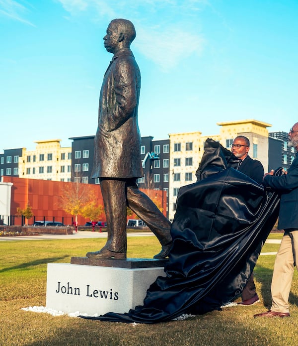 This image provided by the Equal Justice Initiative, a statue of U.S. Rep. John Lewis, a civil rights icon, is unveiled at the Equal Justice Initiative's Legacy Plaza, Tuesday, Nov. 12, 2024, in Montgomery, Ala. (Equal Justice Initiative via AP)