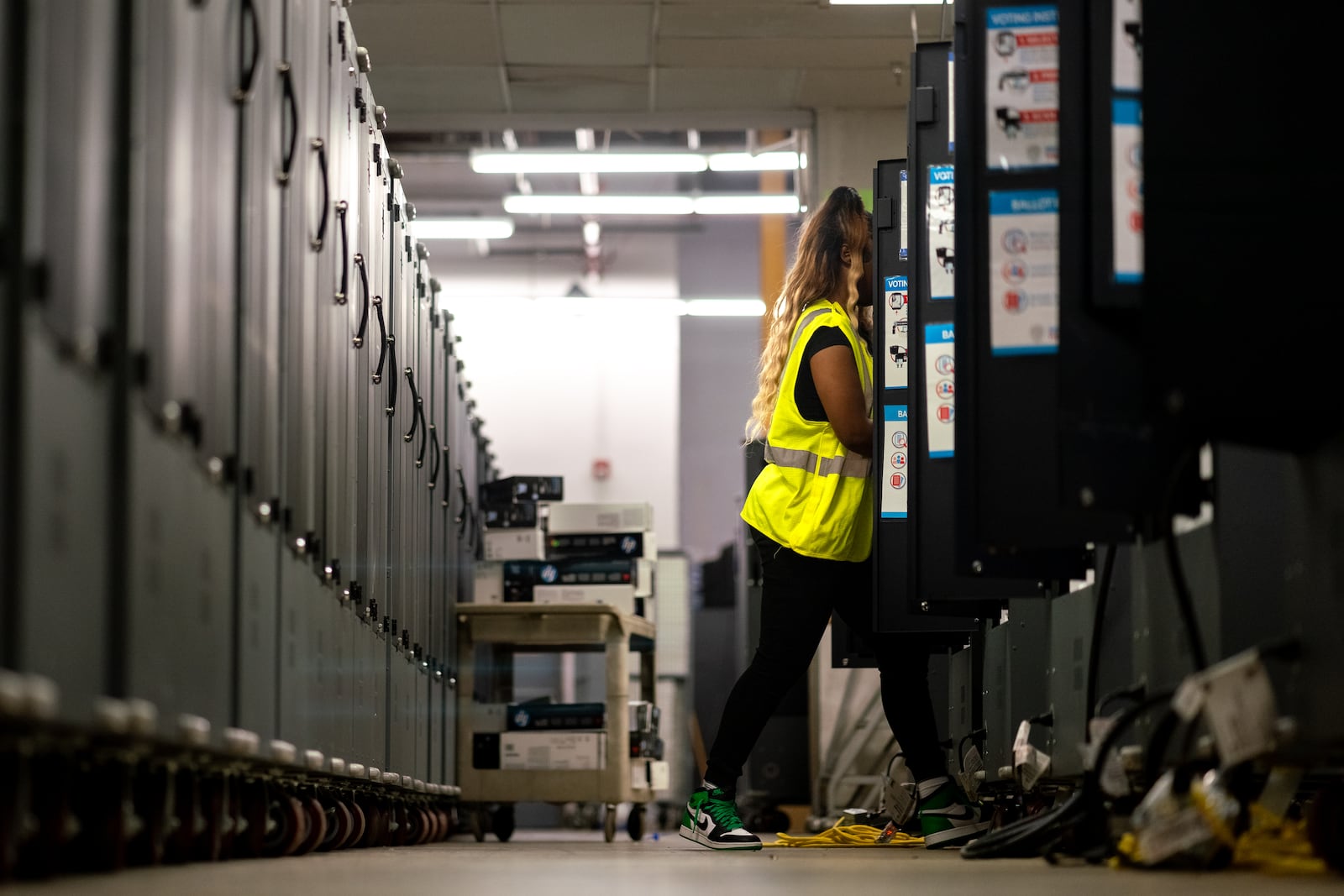 Dekalb County election officials conduct logic and accuracy testing of Dominion voting machines last month.