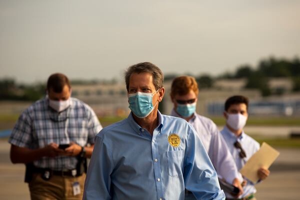 Georgia Gov. Brian Kemp prepares to speak at the Peachtree Dekalb Airport in Atlanta, Georgia, on Thursday, July 1, 2020. Governor Kemp and Georgia Department of Public Health (DPH) Commissioner Dr. Kathleen Toomey will take part in a "Wear a Mask" Flyaround Tour of Georgia, encouraging Georgians to follow the guidance of public health officials to stop the spread of COVID-19 ahead of the 4th of July Weekend. (REBECCA WRIGHT FOR THE ATLANTA JOURNAL-CONSTITUTION)