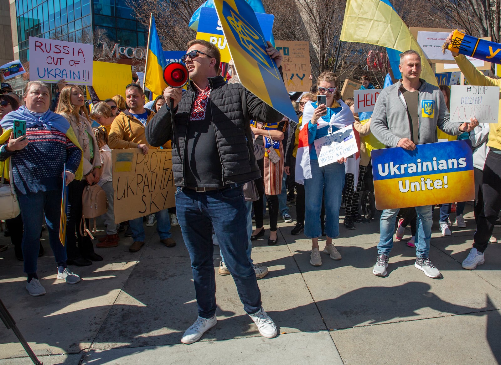 People show their support for Ukraine during a rally near the CNN Center on Saturday, February 26, 2022.  STEVE SCHAEFER FOR THE ATLANTA JOURNAL-CONSTITUTION