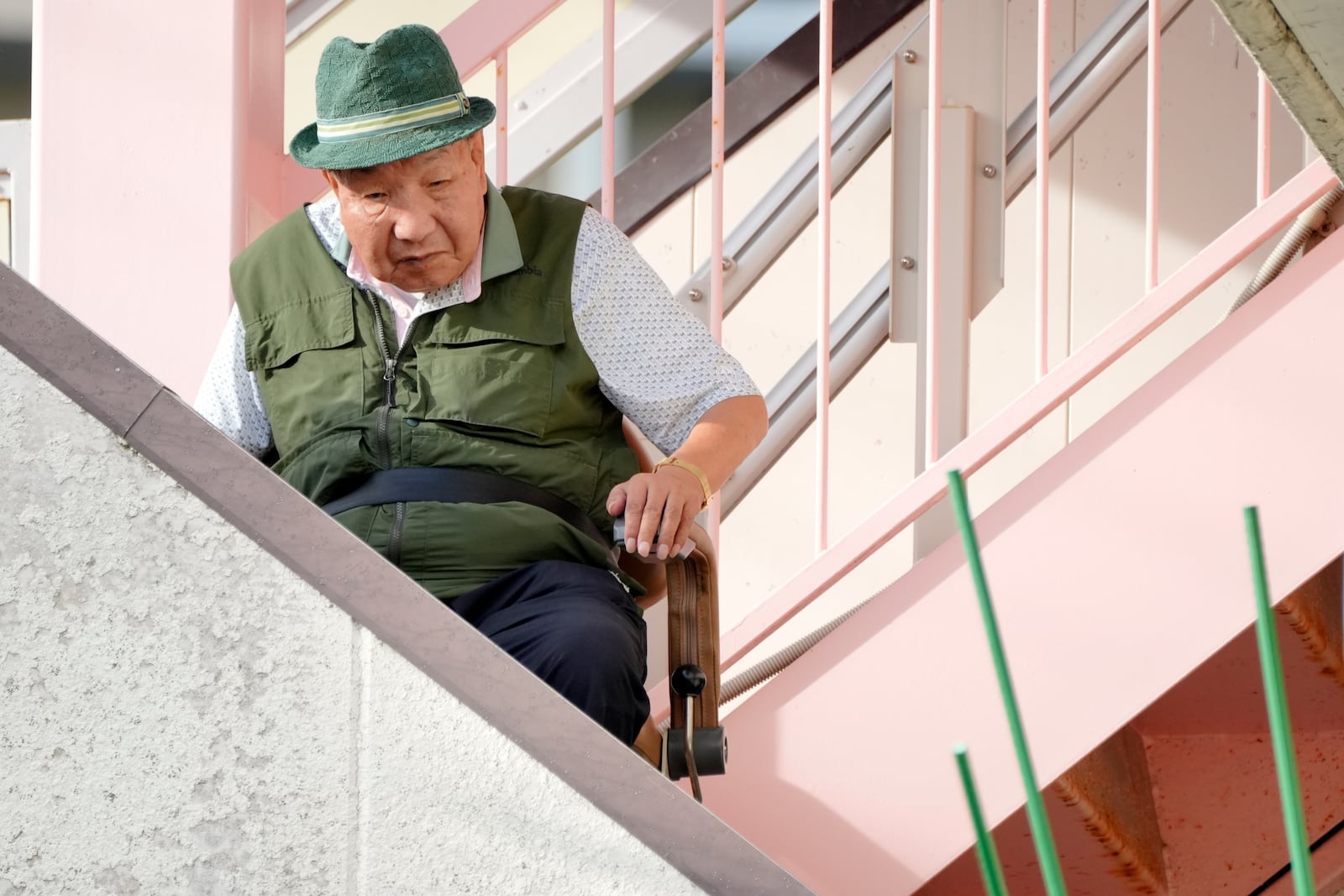 Iwao Hakamada, who was on death row for nearly a half-century and was acquitted last month by the Shizuoka District Court, prepares to go out for a walk in Hamamatsu, Shizuoka prefecture, central Japan, Thursday, Oct. 17, 2024. (AP Photo/Eugene Hoshiko)