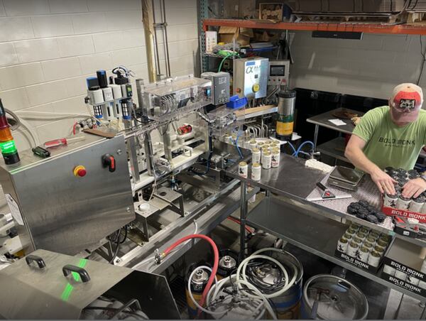 Canned beer gets packaged at Bold Monk Brewing in Atlanta. COURTESY OF BOLD MONK BREWING