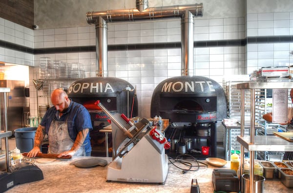 The  kitchen and wood-fried pizza ovens at Grana. CONTRIBUTED BY CHRIS HUNT PHOTOGRAPHY