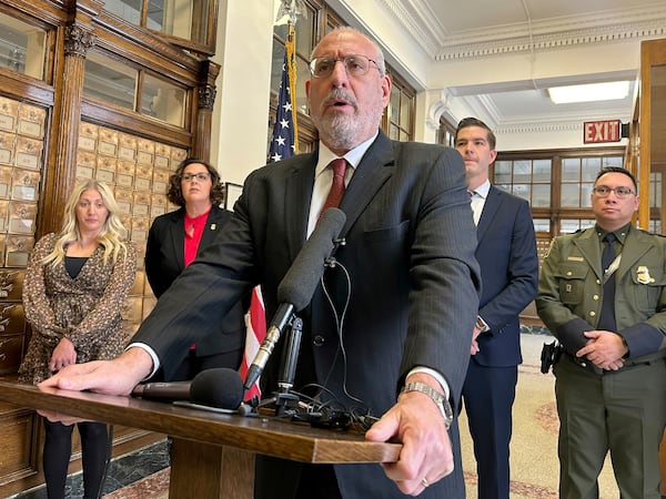 Minnesota U.S. Attorney Andy Luger addresses reporters on Friday, Nov. 22, 2024, at the federal courthouse in Fergus Falls, Minn., after two men were found guilty of human smuggling charges in connection with a case that led to the deaths of a family of four from India, who tried to cross the Canada-U.S. border during a blizzard in 2022. (Steve Lambert/The Canadian Press via AP)