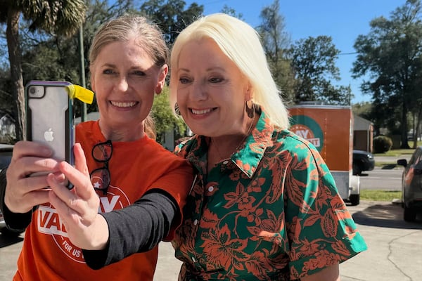 Democratic candidate Gay Valimont poses for a selfie with supporter Selina Vickers outside Valimont's campaign office in Pensacola, Fla. on March 17, 2025. (AP Photo/Kate Payne)