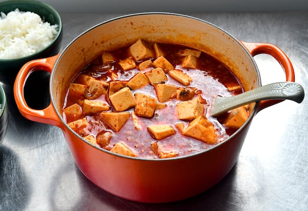 James Park’s Silken Tofu Soup recipe calls for cracking an egg in the serving bowl, then ladling hot boiling soup over the egg to poach. White rice is the traditional accompaniment.
(Styling by Wendell Brock. Chris Hunt for The Atlanta Journal-Constitution)