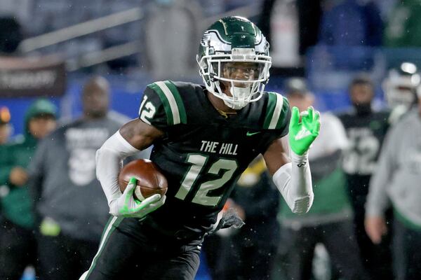 Collins Hill wide receiver Travis Hunter (12) runs after a catch during their game against Milton in the Class 7A state title football game at Center Parc Stadium on Saturday, Dec. 11, 2021, Atlanta. JASON GETZ FOR THE ATLANTA JOURNAL-CONSTITUTION