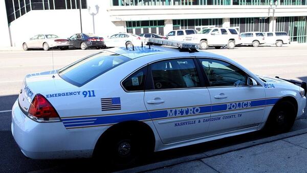 A Nashville Metro Police Car, sits outside the Central Police Precinct, in Nashville, Tennessee. Police responded to a deadly church shooting Sunday morning that left a woman dead and more than a half dozen others injured.