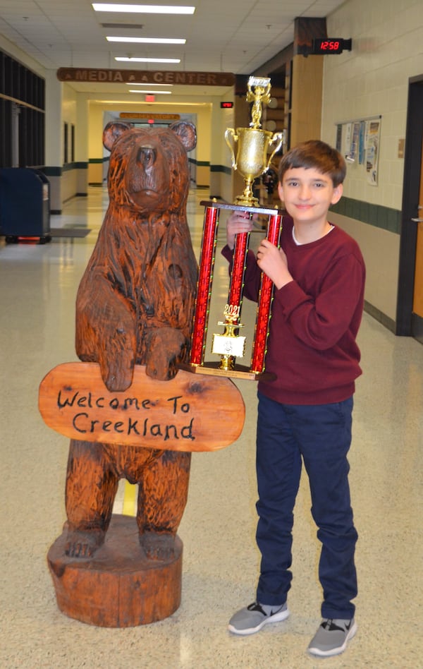 Creekland Middle School seventh-grader Huck Wallace claimed the title as the county’s top speller at the 2021 Cherokee County School District Spelling Bee held January 21.  Huck spelled “dubiously” and then “immolate” to take the top honors.