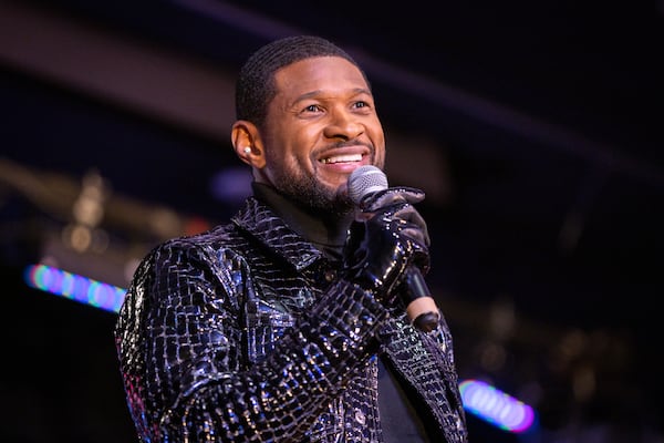 Usher speaks during a homecoming rally at Clark Atlanta University in Atlanta on Wednesday, February 14, 2024. Along with other honors, Amazon presented a $25,000 donation to Usher’s New Look Foundation. (Arvin Temkar / arvin.temkar@ajc.com)