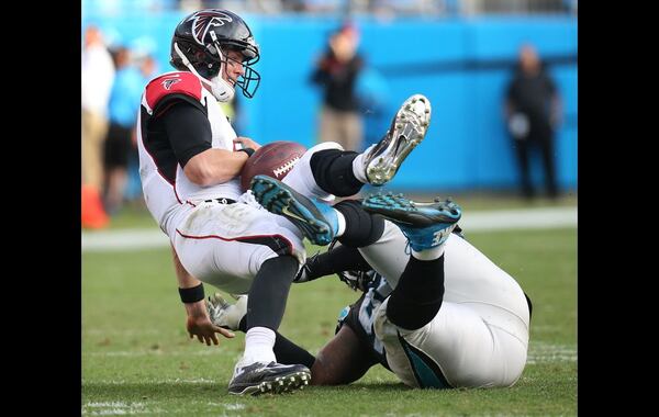 CHARLOTTE: Falcons quarterback Matt Ryan fumbles it away to the Panthers as he is sacked by Panthers defensive tackle Kawann Short during the third quarter in a football game on Sunday, Dec. 13, 2015, in Charlotte. The turnover set up the Panthers for a touchdown to go ahead 38-0 which held up as the final score. Curtis Compton / ccompton@ajc.com