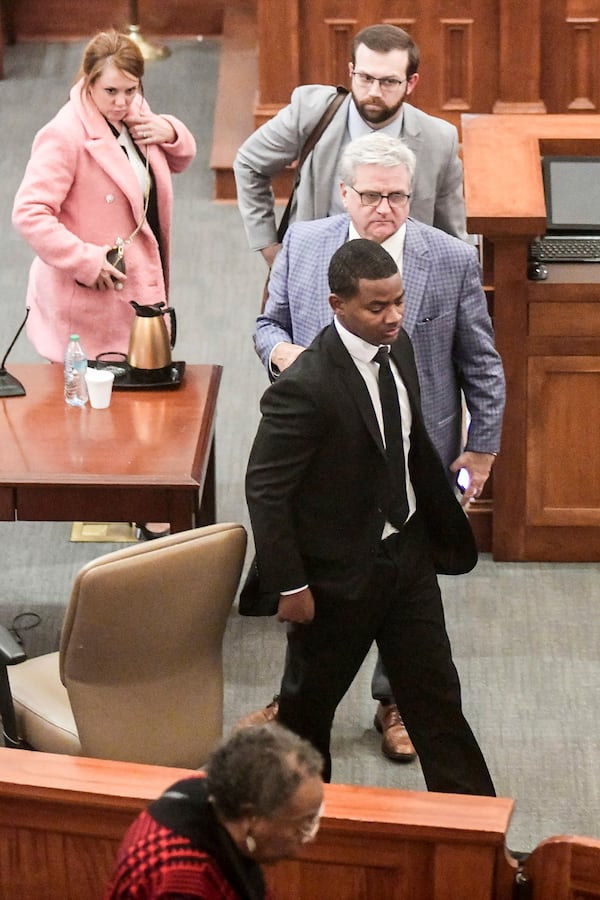 Sheldon "Timothy" Herrington Jr., foreground, who was on trial for the murder of University of Mississippi student Jimmie "Jay" Lee, and his defense team leave court after a mistrial was declared, at the Lafayette County Courthouse in Oxford, Miss. on Wednesday, Dec. 11, 2024. (Bruce Newman/The Northeast Mississippi Daily Journal, via AP, Pool)