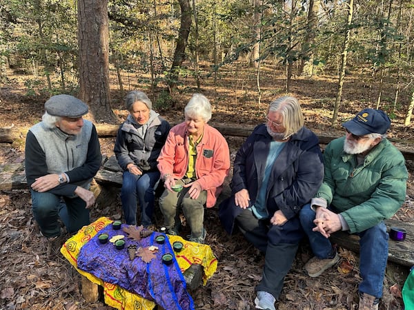 Robin Hancock (center) is a certified Forest Bathing guide. Forest bathing originated in Japan to help stressed out workers relax and appreciate nature. The session end with a tea ceremony where bathers are invited to chat and share their experiences. Image credit: Nedra Rhone