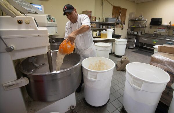 Head baker Cristobal Miranda makes Country Italian bread at the Buckhead Bread Company in Atlanta, July 6, 2020 .STEVE SCHAEFER FOR THE ATLANTA JOURNAL-CONSTITUTION