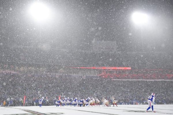 Snow falls at Highmark Stadium during the second half of an NFL football game between the Buffalo Bills and the San Francisco 49ers in Orchard Park, N.Y., Sunday, Dec. 1, 2024. (AP Photo/Adrian Kraus)