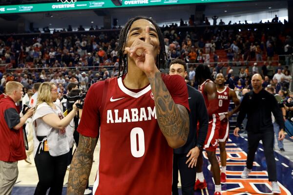 Alabama guard Labaron Philon reacts to fans after they defeated Auburn in overtime in an NCAA college basketball game, Saturday, March 8, 2025, in Auburn, Ala. (AP Photo/Butch Dill)