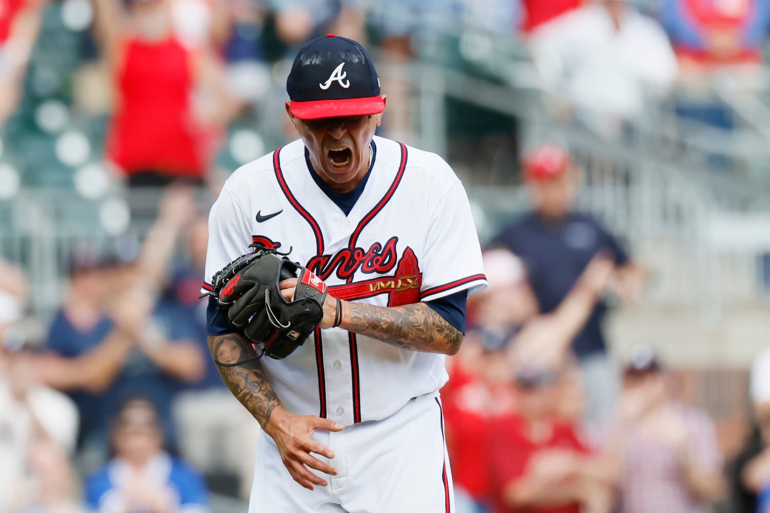 Braves reliever Jesse Chavez reacts after recording the final out Sunday against the Phillies at Truist Park. (Miguel Martinez / miguel.martinezjimenez@ajc.com) 