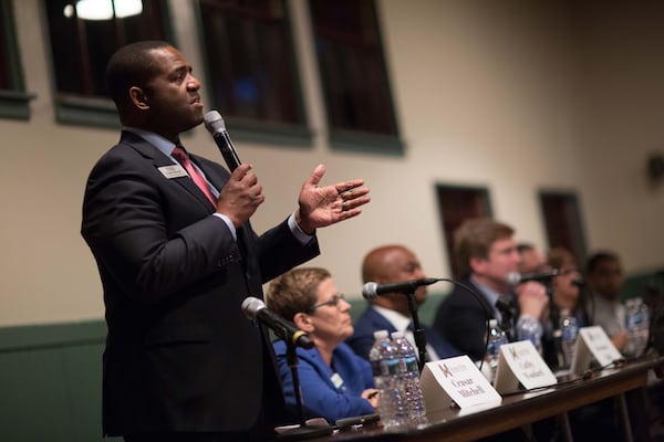 City Council President Ceasar Mitchell (left) talks during an Inman Park mayoral candidate forum in The Trolley Barn, Wednesday, Oct. 4, 2017, in Atlanta. BRANDEN CAMP / SPECIAL