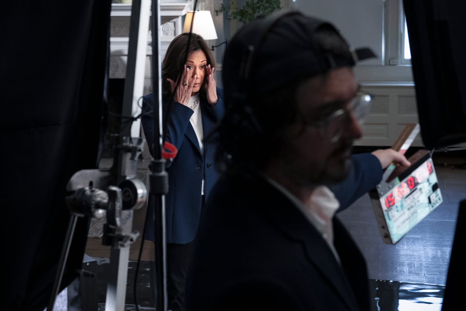 Democratic presidential nominee Vice President Kamala Harris rubs her eyes during a split second break while recording a campaign video, "direct to camera," Tuesday, Oct. 29, 2024, in Washington, ahead of her speech on the ellipse. (AP Photo/Jacquelyn Martin)