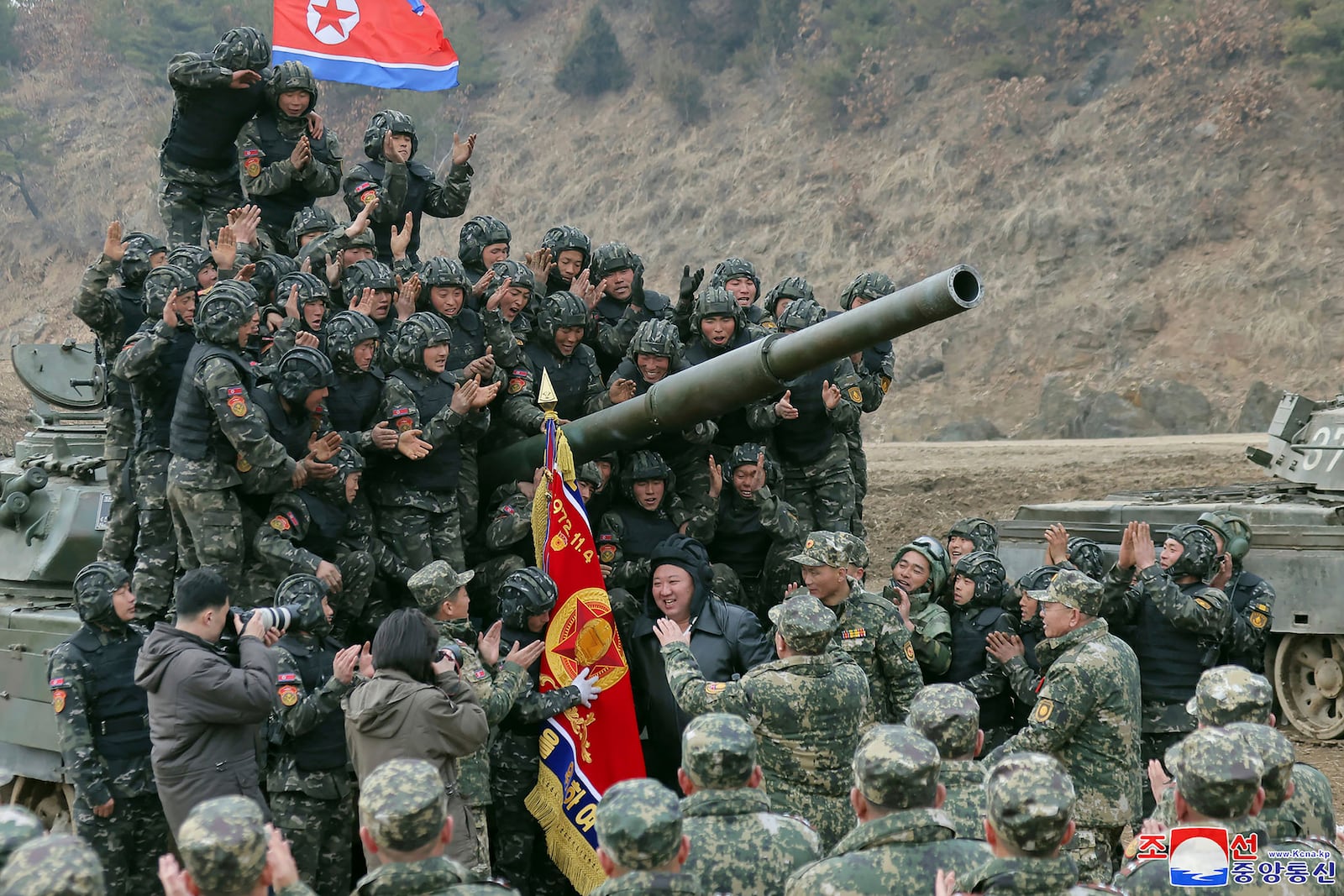 FILE - In this photo provided by the North Korean government, North Korean leader Kim Jong Un, center, meets soldiers who took part in a training in North Korea, on March 13, 2024. Independent journalists were not given access to cover the event depicted in this image distributed by the North Korean government. The content of this image is as provided and cannot be independently verified. Korean language watermark on image as provided by source reads: "KCNA" which is the abbreviation for Korean Central News Agency. (Korean Central News Agency/Korea News Service via AP, File)