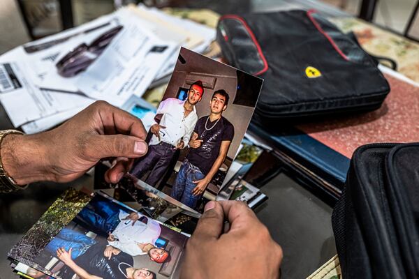 While looking through his mother Miriam Rodríguez’s belongings, Luis Rodriguez finds a photo of Sama, right, whom his mother tracked down while hunting those involved in his sister Karen Rodríguez’s kidnapping and death, Dec. 3, 2020. Before she was gunned down in front of her home in 2017, Miriam Rodríguez had been tracking the people responsible for the kidnapping and murder of her 20-year-old daughter Karen, and had captured nearly every living member of the crew that abducted her for ransom.