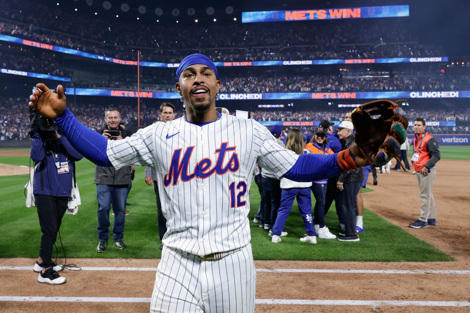 New York Mets shortstop Francisco Lindor (12) celebrates after the Mets beat the Philadelphia Phillies in Game 4 of the National League baseball playoff series, Wednesday, Oct. 9, 2024, in New York. (AP Photo/Adam Hunger)