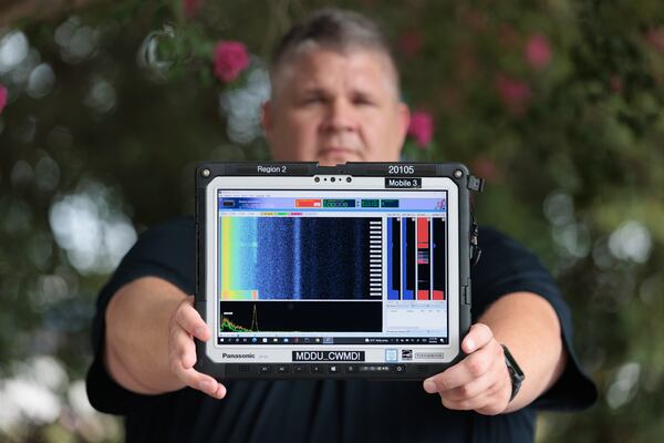 Brian Kuleski, Department of Homeland Security division director for the mobile detection deployment program, poses in Atlanta with a device that monitors gamma and nuclear radiation on Wednesday, August 3, 2022. (Arvin Temkar / arvin.temkar@ajc.com)