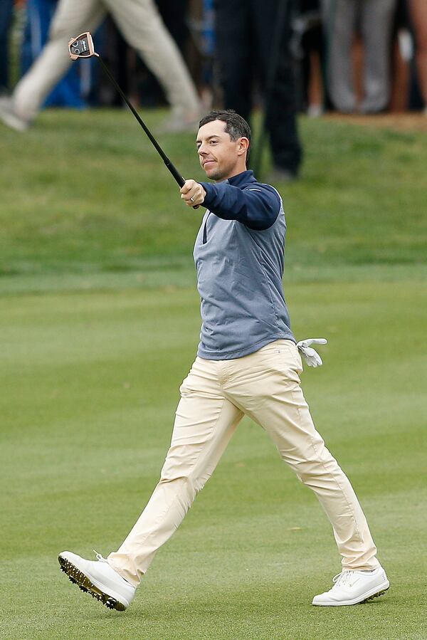 Rory McIlroy takes his victory walk up 18 at this year's Players Championship. (Photo by Michael Reaves/Getty Images)