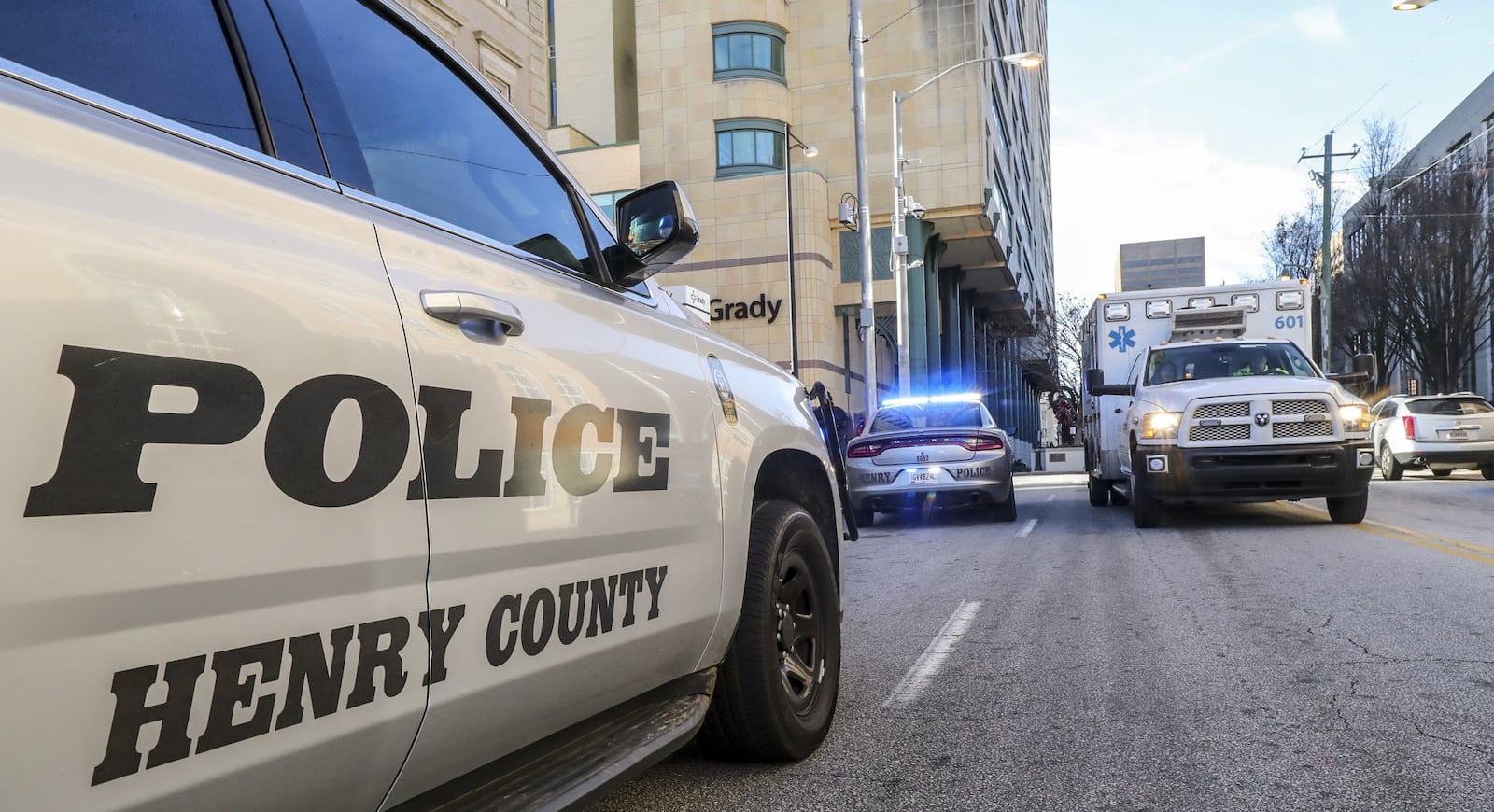 December 6, 2018 Henry County: Henry County police cars parked outside Grady Memorial Hospital in Atlanta after a shooting of a fellow officer inside a Henry County dentist’s office early Thursday, Dec. 6, 2018. JOHN SPINK/JSPINK@AJC.COM