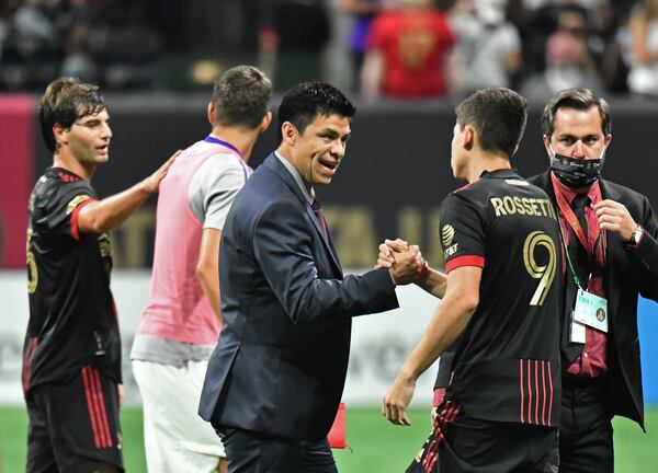 Atlanta United manager Gonzalo Pineda celebrates with Atlanta United's midfielder Matheus Rossetto (9) after they won over Orlando City in a MLS soccer match at Mercedes-Benz Stadium in Atlanta on Friday, September 10, 2021. Atlanta United won 3-0 over Orlando City. (Hyosub Shin / Hyosub.Shin@ajc.com)