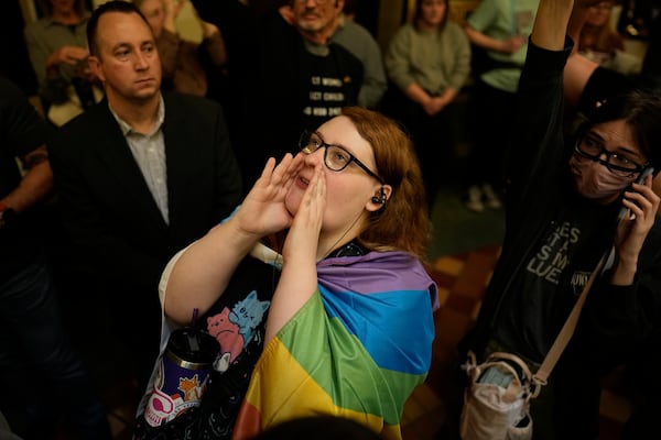 Protesters fill the Iowa state Capitol to denounce a bill that would strip the state civil rights code of protections based on gender identity, Thursday, Feb. 27, 2025, in Des Moines, Iowa. (AP Photo/Charlie Neibergall)