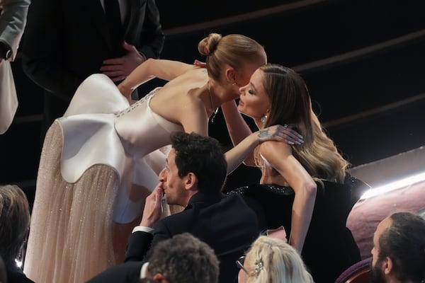 Ariana Grande, from left, Adrien Brody, and Georgina Chapman in the audience during the Oscars on Sunday, March 2, 2025, at the Dolby Theatre in Los Angeles. (AP Photo/Chris Pizzello)